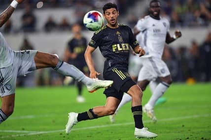 July 8, 2023; Los Angeles, California, USA; Los Angeles FC forward Carlos Vela (10) plays for the ball against San Jose Earthquakes defender Rodrigues (26) during the second half at BMO Stadium. Mandatory Credit: Gary A. Vasquez-USA TODAY Sports