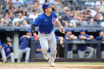 Jul 9, 2023; Bronx, New York, USA;  Chicago Cubs right fielder Seiya Suzuki (27) hits a go ahead RBI sacrifice fly in the eighth inning against the New York Yankees at Yankee Stadium. Mandatory Credit: Wendell Cruz-USA TODAY Sports