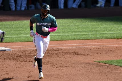 Jul 11, 2023; Seattle, Washington, USA; American League first baseman Yandy Diaz of the Tampa Bay Rays (2) reacts after hitting a home run during the second inning against the National Team at T-Mobile Park. Mandatory Credit: Steven Bisig-USA TODAY Sports