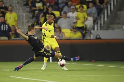 Jul 12, 2023; Nashville, Tennessee, USA;  Philadelphia Union defender Jack Elliott (3) blocks a shot from Nashville SC forward Teal Bunbury (12) in the second half at Geodis Park. Mandatory Credit: Steve Roberts-USA TODAY Sports