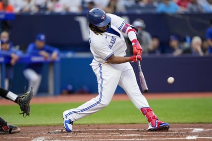 Jul 14, 2023; Toronto, Ontario, CAN; Toronto Blue Jays first baseman Vladimir Guerrero Jr. (27) hits a home run against the Arizona Diamondbacks during the second inning at Rogers Centre. Mandatory Credit: Kevin Sousa-USA TODAY Sports