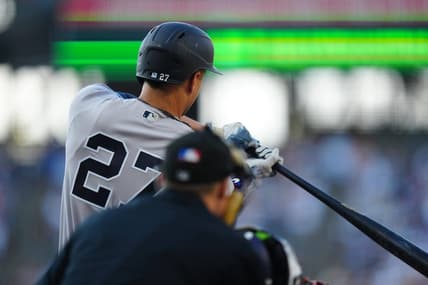 Jul 14, 2023; Denver, Colorado, USA; New York Yankees right fielder Giancarlo Stanton (27) hits a two run home run in the first inning against the Colorado Rockies at Coors Field. Mandatory Credit: Ron Chenoy-USA TODAY Sports