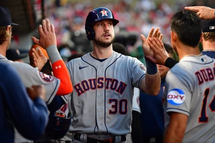 Jul 14, 2023; Anaheim, California, USA; Houston Astros right fielder Kyle Tucker (30) is greeted after scoring a run against the Los Angeles Angels during the fifth inning at Angel Stadium. Mandatory Credit: Gary A. Vasquez-USA TODAY Sports