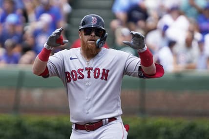 Jul 15, 2023; Chicago, Illinois, USA; Boston Red Sox designated hitter Justin Turner (2) gestures after hitting a double against the Chicago Cubs during the first inning at Wrigley Field. Mandatory Credit: David Banks-USA TODAY Sports