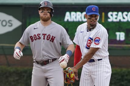 Jul 15, 2023; Chicago, Illinois, USA; Boston Red Sox second baseman Christian Arroyo (39) is safe at second base with a double as Chicago Cubs second baseman Christopher Morel (5) takes the throw during the ninth inning at Wrigley Field. Mandatory Credit: David Banks-USA TODAY Sports