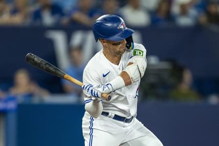 Jul 15, 2023; Toronto, Ontario, CAN; Toronto Blue Jays second baseman Whit Merrifield (15) hits a single during the second inning against the Arizona Diamondbacks at Rogers Centre. Mandatory Credit: Kevin Sousa-USA TODAY Sports