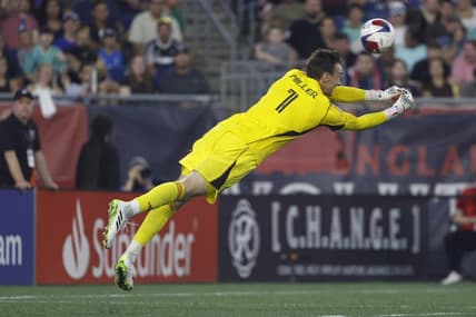 Jul 15, 2023; Foxborough, Massachusetts, USA; A header by New England Revolution forward Gustavo Bou (7) gets past D.C. United goalkeeper Tyler Miller (1) for a goal during the first half at Gillette Stadium. Mandatory Credit: Winslow Townson-USA TODAY Sports