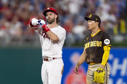 Jul 15, 2023; Philadelphia, Pennsylvania, USA; Philadelphia Phillies designated hitter Bryce Harper (3) reacts next to San Diego Padres second baseman Ha-Seong Kim (7) after hitting a double during the fifth inning at Citizens Bank Park. Mandatory Credit: Bill Streicher-USA TODAY Sports