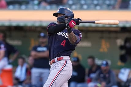 Jul 15, 2023; Oakland, California, USA; Minnesota Twins shortstop Carlos Correa (4) hits a double against the Oakland Athletics during the eighth inning at Oakland-Alameda County Coliseum. Mandatory Credit: Darren Yamashita-USA TODAY Sports