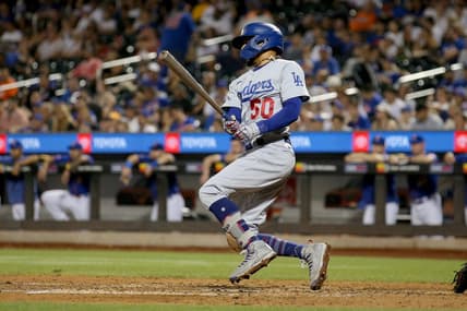 Jul 15, 2023; New York City, New York, USA; Los Angeles Dodgers second baseman Mookie Betts (50) follows through on a single against the New York Mets during the ninth inning at Citi Field. Mandatory Credit: Brad Penner-USA TODAY Sports