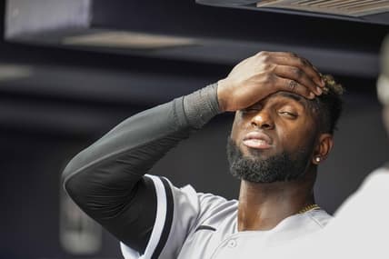 Jul 16, 2023; Cumberland, Georgia, USA; Chicago White Sox center fielder Luis Robert Jr. (88) reacts while standing under the air conditioner vent in the dugout against the Atlanta Braves during the seventh inning at Truist Park. Mandatory Credit: Dale Zanine-USA TODAY Sports