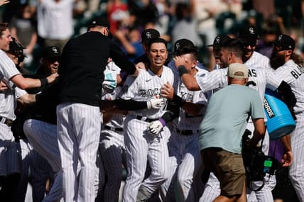 Jul 16, 2023; Denver, Colorado, USA; Colorado Rockies second baseman Alan Trejo (13) celebrates with teammates on a walk-off solo home run in the eleventh inning against the New York Yankees at Coors Field. Mandatory Credit: Isaiah J. Downing-USA TODAY Sports