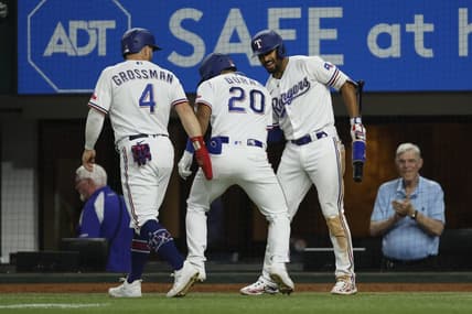 Jul 17, 2023; Arlington, Texas, USA; Texas Rangers left fielder Ezequiel Duran (20) is congratulated by designated hitter Robbie Grossman (4) and second baseman Marcus Semien (2) after hitting a two-run home run in the sixth inning against the Tampa Bay Rays at Globe Life Field. Mandatory Credit: Tim Heitman-USA TODAY Sports