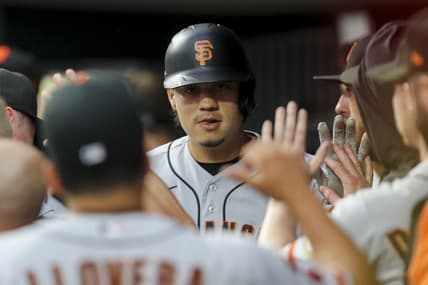 Jul 18, 2023; Cincinnati, Ohio, USA; San Francisco Giants designated hitter Wilmer Flores (41) high fives teammates after hitting a solo home run in the first inning against the Cincinnati Reds at Great American Ball Park. Mandatory Credit: Katie Stratman-USA TODAY Sports