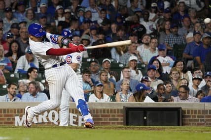 Jul 18, 2023; Chicago, Illinois, USA; Chicago Cubs catcher Miguel Amaya (6) hits a two-run single against the Washington Nationals during the seventh inning at Wrigley Field. Mandatory Credit: David Banks-USA TODAY Sports
