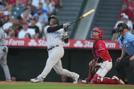 Jul 18, 2023; Anaheim, California, USA; New York Yankees second baseman Gleyber Torres (25) hits a home run in the second inning against the Los Angeles Angels at Angel Stadium. Mandatory Credit: Kirby Lee-USA TODAY Sports