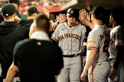 San Francisco Giants first baseman Wilmer Flores (41) celebrates with teammates after hitting a game tying 3-run home run in the third inning of the MLB baseball game between the Cincinnati Reds and San Francisco Giants at Great American Ball Park in Cincinnati on Tuesday, July 18, 2023.