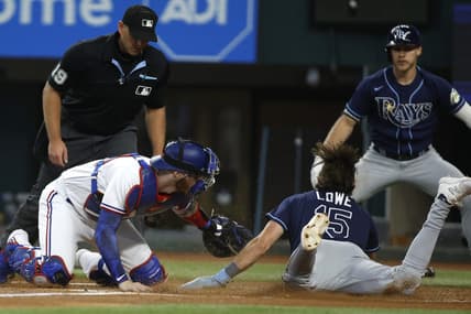 Jul 19, 2023; Arlington, Texas, USA; Texas Rangers catcher Jonah Heim (28) tags Tampa Bay Rays designated hitter Josh Lowe (15) out at home plate in the second inning at Globe Life Field. Mandatory Credit: Tim Heitman-USA TODAY Sports