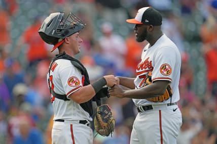 Jul 19, 2023; Baltimore, Maryland, USA; Baltimore Orioles pitcher Felix Bautista (right) greets catcher James McCann (left) after earning a save against the Los Angeles Dodgers at Oriole Park at Camden Yards. Mandatory Credit: Mitch Stringer-USA TODAY Sports
