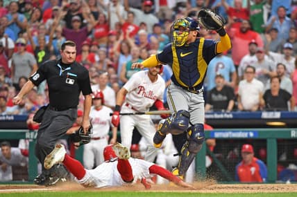 Jul 19, 2023; Philadelphia, Pennsylvania, USA; Philadelphia Phillies center fielder Brandon Marsh (16) slides safely into home as Milwaukee Brewers catcher William Contreras (24) moves out of the way during the fifth inning at Citizens Bank Park. Mandatory Credit: Eric Hartline-USA TODAY Sports