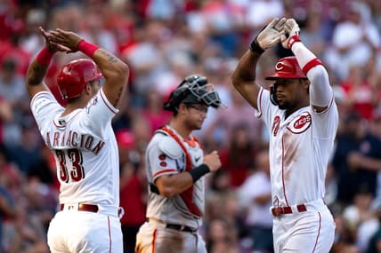 Cincinnati Reds left fielder Will Benson (30) high fives Cincinnati Reds first baseman Christian Encarnacion-Strand (33) after hitting a 3-run home run in the third inning of the baseball game between the Cincinnati Reds and San Francisco Giants at Great American Ball Park in Cincinnati on Wednesday, July 19, 2023.
