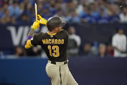 Jul 19, 2023; Toronto, Ontario, CAN; San Diego Padres third baseman Manny Machado (13) breaks his bat on a two run single against the Toronto Blue Jays during the fifth inning at Rogers Centre. Mandatory Credit: John E. Sokolowski-USA TODAY Sports