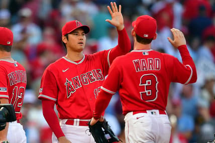 Jul 19, 2023; Anaheim, California, USA; Los Angeles Angels designated hitter Shohei Ohtani (17) and left fielder Taylor Ward (3) celebrate the victory against the New York Yankees at Angel Stadium. Mandatory Credit: Gary A. Vasquez-USA TODAY Sports