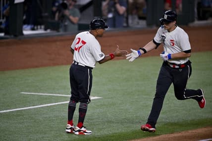 Jul 21, 2023; Arlington, Texas, USA; Texas Rangers shortstop Corey Seager (5) rounds the bases past third base coach Tony Beasley (27) after he hits a home run against the Los Angeles Dodgers during the sixth inning at Globe Life Field. Mandatory Credit: Jerome Miron-USA TODAY Sports
