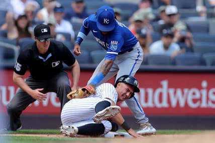 Jul 22, 2023; Bronx, New York, USA; New York Yankees shortstop Anthony Volpe (11) steals third base ahead of a tag by Kansas City Royals third baseman Maikel Garcia (11) during the third inning at Yankee Stadium. Mandatory Credit: Brad Penner-USA TODAY Sports