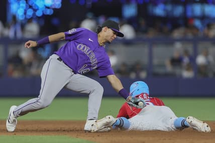Jul 22, 2023; Miami, Florida, USA; Miami Marlins left fielder Jon Berti (5) steals second base against Colorado Rockies shortstop Ezequiel Tovar (14) during the seventh inning at loanDepot Park. Mandatory Credit: Sam Navarro-USA TODAY Sports