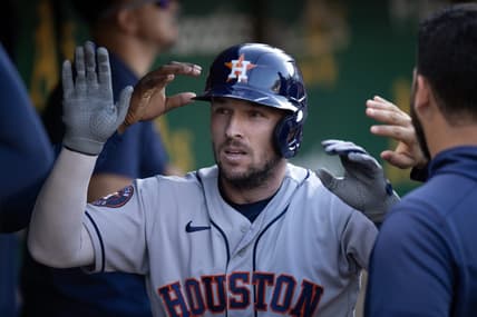 Jul 22, 2023; Oakland, California, USA; Houston Astros third baseman Alex Bregman (2) is greeted by his teammates after hitting a solo home run against the Oakland Athletics during the sixth inning at Oakland-Alameda County Coliseum. Mandatory Credit: D. Ross Cameron-USA TODAY Sports