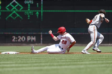 Jul 23, 2023; Washington, District of Columbia, USA; Washington Nationals right fielder Lane Thomas (28) steals second base ahead of a tag by San Francisco Giants second baseman Brett Wisely (70) during the first inning at Nationals Park. Mandatory Credit: Geoff Burke-USA TODAY Sports