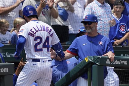 Jul 23, 2023; Chicago, Illinois, USA; Chicago Cubs center fielder Cody Bellinger (24) is greeted by Chicago Cubs manager David Ross (3) after hitting a two-run homer against the St. Louis Cardinals during the first inning at Wrigley Field. Mandatory Credit: David Banks-USA TODAY Sports
