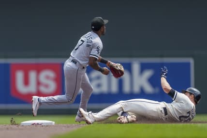 Jul 23, 2023; Minneapolis, Minnesota, USA; Minnesota Twins right fielder Max Kepler (26) doubles as Chicago White Sox shortstop Tim Anderson (7) fields the throw from right in the second inning at Target Field. Mandatory Credit: Matt Blewett-USA TODAY Sports