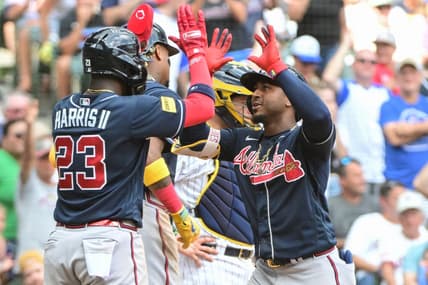 Jul 23, 2023; Milwaukee, Wisconsin, USA; Atlanta Braves second baseman Ozzie Albies (1) is greeted by center fielder Michael Harris (23) after hitting a three run home run in the eighth inning against the Milwaukee Brewers at American Family Field. Mandatory Credit: Benny Sieu-USA TODAY Sports