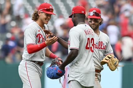Jul 23, 2023; Cleveland, Ohio, USA; Philadelphia Phillies relief pitcher Yunior Marte (43) celebrates with third baseman Alec Bohm (28) and Bryce Harper (3) after the Phillies beat the Cleveland Guardians at Progressive Field. Mandatory Credit: Ken Blaze-USA TODAY Sports
