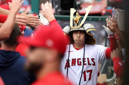 Jul 23, 2023; Anaheim, California, USA;  Los Angeles Angels designated hitter Shohei Ohtani (17) is greeted in the dugout after hitting a home run during the first inning against the Pittsburgh Pirates at Angel Stadium. Mandatory Credit: Kiyoshi Mio-USA TODAY Sports