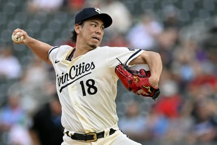 Jul 24, 2023; Minneapolis, Minnesota, USA;  Minnesota Twins pitcher Kenta Maeda (18) delivers a pitch against the Seattle Mariners during the first inning at Target Field. Mandatory Credit: Nick Wosika-USA TODAY Sports