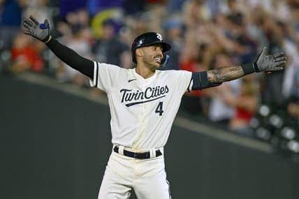 Jul 24, 2023; Minneapolis, Minnesota, USA;  Minnesota Twins infielder Carlos Correa (4) celebrates his walk-off RBI single against the Seattle Mariners during the tenth inning at Target Field. Mandatory Credit: Nick Wosika-USA TODAY Sports