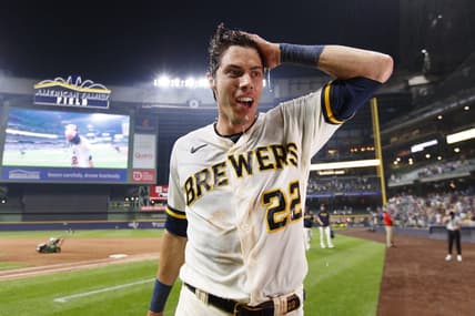 Jul 24, 2023; Milwaukee, Wisconsin, USA;  Milwaukee Brewers left fielder Christian Yelich (22) reacts after being dunked with Gatorade following the game against the Cincinnati Reds at American Family Field. Mandatory Credit: Jeff Hanisch-USA TODAY Sports
