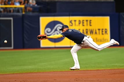 Jul 25, 2023; St. Petersburg, Florida, USA; Tampa Bay Rays third baseman Isaac Paredes (17) reaches for a line drive in the second inning against the Miami Marlins  at Tropicana Field. Mandatory Credit: Jonathan Dyer-USA TODAY Sports