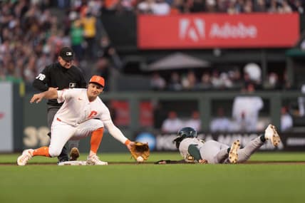 Jul 25, 2023; San Francisco, California, USA;  Oakland Athletics second baseman Zack Gelof (20) slides during the sixth inning against San Francisco Giants shortstop Casey Schmitt (6) at Oracle Park. Mandatory Credit: Stan Szeto-USA TODAY Sports