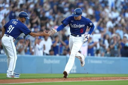 Jul 25, 2023; Los Angeles, California, USA; Los Angeles Dodgers first baseman Freddie Freeman (5) is congratulated by third base coach Dino Ebel (91) after hitting a solo home run in the first inning against the Toronto Blue Jays at Dodger Stadium. Mandatory Credit: Kirby Lee-USA TODAY Sports