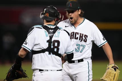 Jul 25, 2023; Phoenix, Arizona, USA; Arizona Diamondbacks relief pitcher Kevin Ginkel (37) celebrates with Arizona Diamondbacks catcher Carson Kelly (18) after defeating the St. Louis Cardinals at Chase Field. Mandatory Credit: Joe Camporeale-USA TODAY Sports