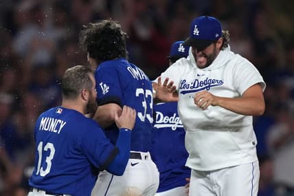 Jul 25, 2023; Los Angeles, California, USA; Los Angeles Dodgers center fielder James Outman (33) celebrates with third baseman Max Muncy (13) and pitcher Clayton Kershaw after hitting a walk-off double in the 10th inning against the Toronto Blue Jays at Dodger Stadium. Mandatory Credit: Kirby Lee-USA TODAY Sports