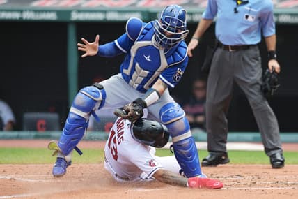 Jul 26, 2023; Cleveland, Ohio, USA; Cleveland Guardians shortstop Gabriel Arias (13) slides under the tag of Kansas City Royals catcher Freddy Fermin (34) during the second inning at Progressive Field. Mandatory Credit: Ken Blaze-USA TODAY Sports
