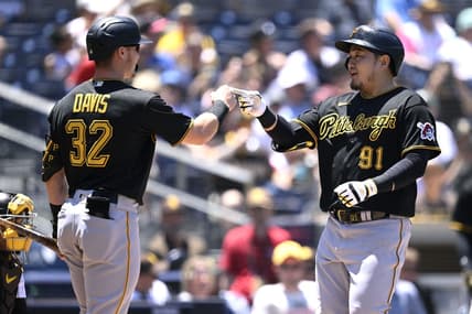 Jul 26, 2023; San Diego, California, USA; Pittsburgh Pirates first baseman Ji-Man Choi (91) is congratulated by right fielder Henry Davis (32) after hitting a home run against the San Diego Padres during the second inning at Petco Park. Mandatory Credit: Orlando Ramirez-USA TODAY Sports
