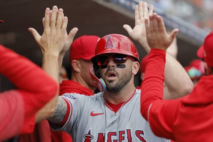 Jul 27, 2023; Detroit, Michigan, USA;  Los Angeles Angels third baseman Mike Moustakas (8) receives congratulations from teammates after scoring in the second inning against the Detroit Tigers at Comerica Park. Mandatory Credit: Rick Osentoski-USA TODAY Sports