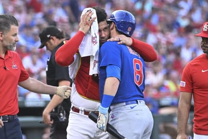 Jul 27, 2023; St. Louis, Missouri, USA; St. Louis Cardinals catcher Willson Contreras (40) hugs Chicago Cubs left fielder Ian Happ (8) after being hit by Happs follow through in the first inning at Busch Stadium. Mandatory Credit: Joe Puetz-USA TODAY Sports