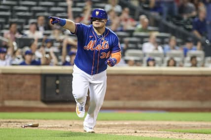 Jul 27, 2023; New York City, New York, USA; New York Mets designated hitter Daniel Vogelbach (32) points to the dugout after hitting a game-tying RBI single in the eighth inning against the Washington Nationals at Citi Field. Mandatory Credit: Wendell Cruz-USA TODAY Sports